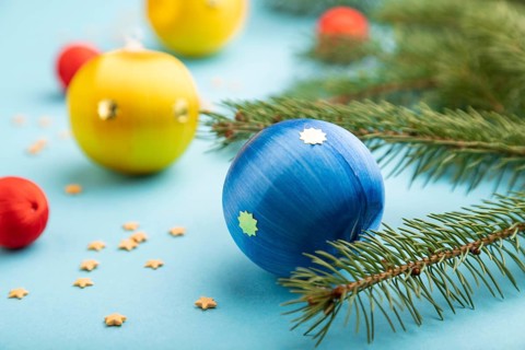 Christmas or New Year composition. Decorations, blue, red, yellow balls, fir and spruce branches,