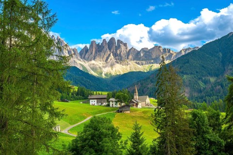 Scenic landscape showing st. Magdalena church in val di funes with the odle mountain range in the