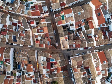Streets and rooftops in the White Town of Olvera. Aerial view. Drone shot. Cádiz province,