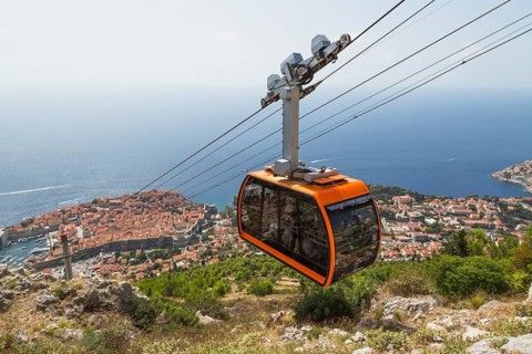 High angle view of cable car transporting tourists from Dubrovnik city center to top of Mount Srd
