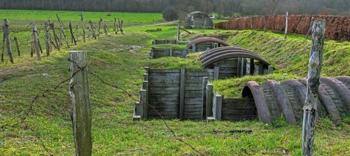 Reconstructed World War One trench with elephant shelters made of corrugated iron near WWI