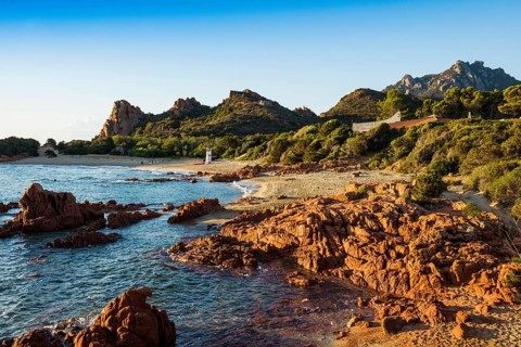 Lonely picturesque beach and red rocks, Spiaggia Su Sirboni, sunrise, near Tertenia, Province of