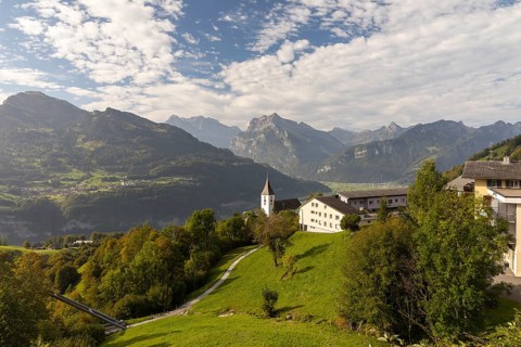 View of Amden with St Gallus church above Lake Walen, in the background Filzbach, Weesen and