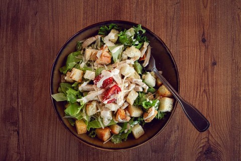 Classic Caesar salad, close-up, natural light, selective focus, horizontal
