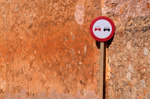 Traffic sign Overtaking prohibited, Overtaking prohibited, on a house wall, ochre-coloured, Alaró,