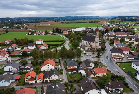 Drone shot, view of village with church, Burgkirchen, Innviertel, Upper Austria, Austria