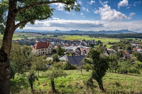 View from the viewing terrace of the town of Aach in Hegau with a view of the volcanic cones