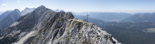 Aerial view, Alpine panorama, hikers at the summit cross, Westliche Wettersteinspitze, Wetterstein