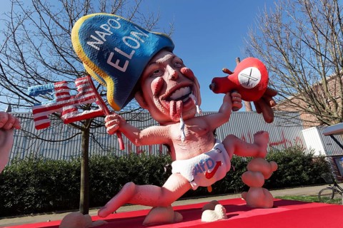 Elon Musk with Napoleon hat, wearing nappy trousers with AfD logo, papier-mâché figure, themed