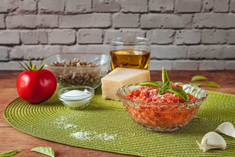 Food photography, making tomato pesto, with tomatoes (Solanum lycopersicum), salt, sunflower