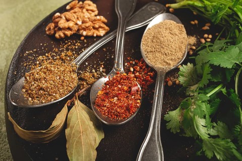 Georgian spices in spoons, on ketsi, top view, no people