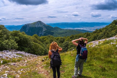 Mount Aizkorri 1523 meters, the highest in Guipuzcoa. Basque Country. Two friends on the trail to