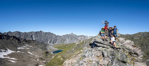 Group of mountaineers on the summit of the Göseleswand, mountain landscape with rocky mountain
