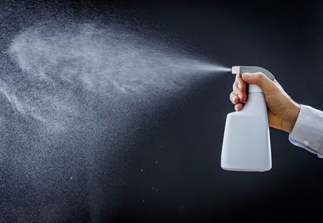 A man sprays a liquid into the air in Berlin, 09/08/2024