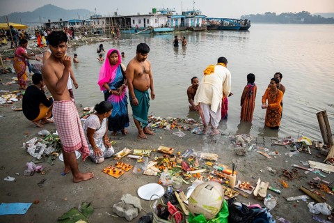 People offer prayers on the bank of Brahmaputra river on Ashoka Ashtami Festival during Chaitra