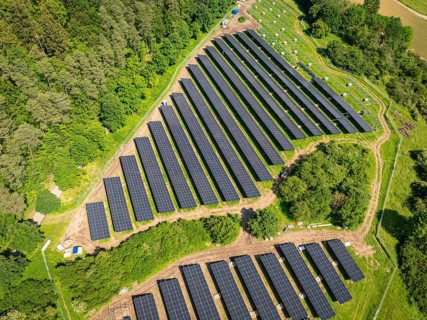 Aerial view of solar panels on an area at the edge of a forest, construction of the Black Forest