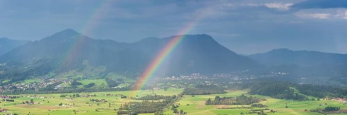 Panorama from the Grünten over the Illertal with rainbow to Blaichach and Immenstadt, behind