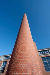 Former factory chimney in a new housing estate, Spardorf, Middle Franconia, Bavaria, Germany