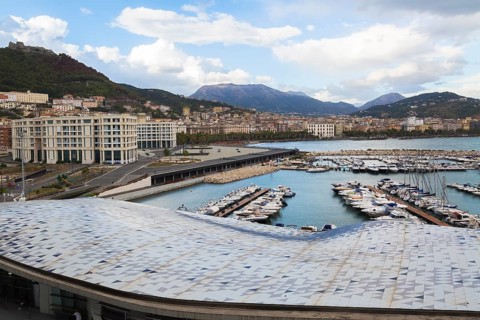 High angle view of roof of Salerno cruise port terminal building by Zaha Hadid and marina with