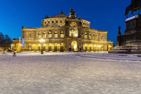Illuminated Semper Opera House and Theatre Square with snow at dusk, Old Town of Dresden, Saxony,