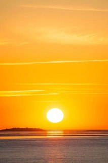 Picturesque, golden, magnificently beautiful sunset over the sea, Langlütjen II island far away,