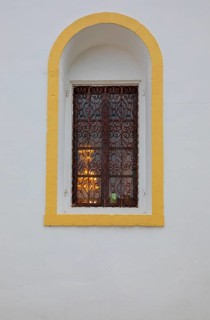 Mountain village Lakkoi with Agios Antonios church, church window, Crete, Greece