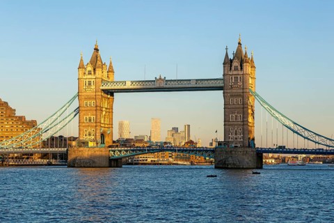 Tower Bridge in sunshine at dusk, River Thames from Southwark, London, England, UK