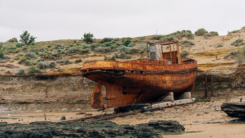 Abandoned supply boat, abandoned Swift factory, The Swift refrigerator in Puerto San Julián, Puerto