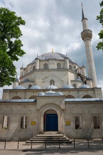 View of a mosque with a large dome and a high minaret surrounded by trees, Tombul Mosque, Sherif