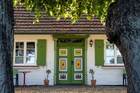 Colourful decorated front door in Bliesenrade at Wieck am Darß, holiday resort on the Darß