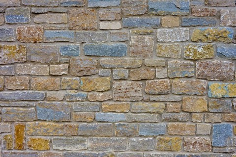 Natural stone wall with blue, grey discolouration and varied structure, Würzburg, Bavaria, Germany