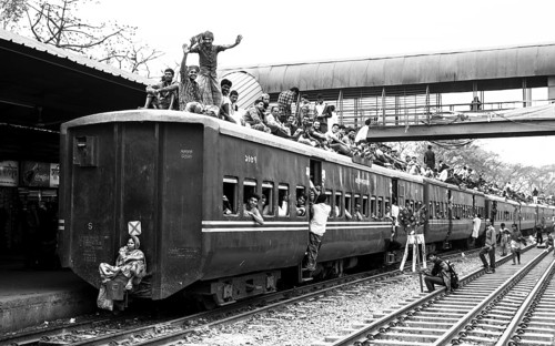 Passengers on the roof of a crowded train, Monochrom, Dhaka, Bangladesh