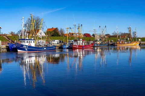 The fishing village of Greetsiel, historic fishing harbour, with the largest shrimp cutter fleet in