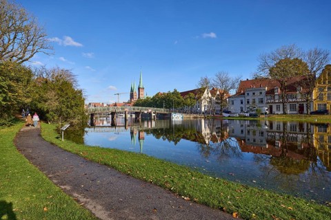 River Trave at high water, general architecture, footpath, pedestrian bridge, trees and bushes,