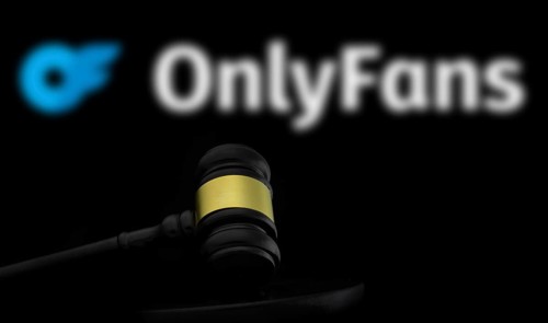 Court gavel in front of the OnlyFans logo. OnlyFans is an internet content subscription service