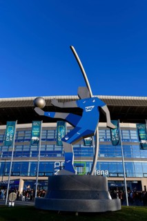 Exterior shot, statue, rotating football player with SAP advert on shirt, glass front, logo, main