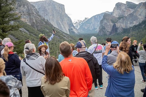 Yosemite National Park, California - A park ranger talks to tourists at the western entrance to