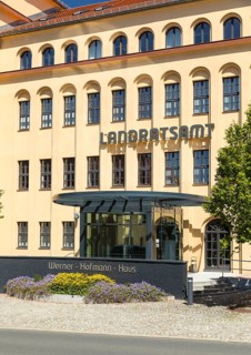 Former porcelain factory, today district administration office, entrance area with lettering
