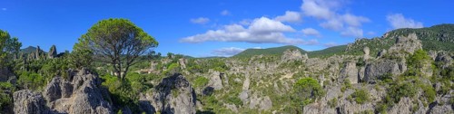 Panorama of the rock labyrinth and view of the village of Mourèze, Département Hérault, France