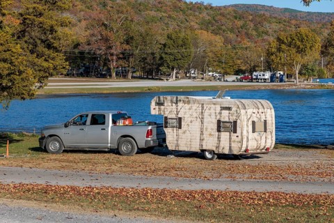 Travel trailer camper at a camp site at Marion County Park on the shore of the Nickajack Lake in