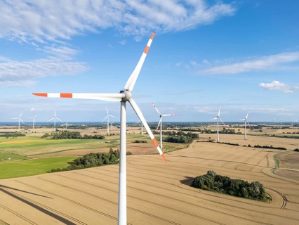 Wind turbine in a wind farm renewable energy wind power wind energy on the Baltic Sea aerial view