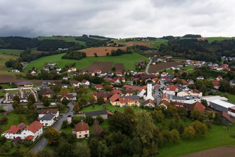 Drone shot, view of village with church, Enzenkirchen, Innviertel, Upper Austria, Austria
