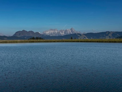 Tyrolean mountains near Saalbach-Hinterglemm, view over the Zwölferkogel reservoir, behind
