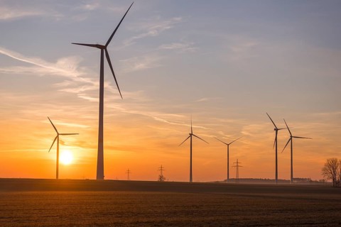 Sunset landscape with several wind turbines in the foreground, near Ulm, Swabian Alb,