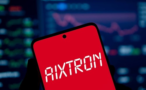 AIXTRON logo is displayed on smartphone. Aixtron SE is a European multinational technology company.