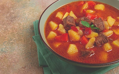 Meat goulash, with potatoes and carrots, sweet pepper, traditional Hungarian soup, homemade, no