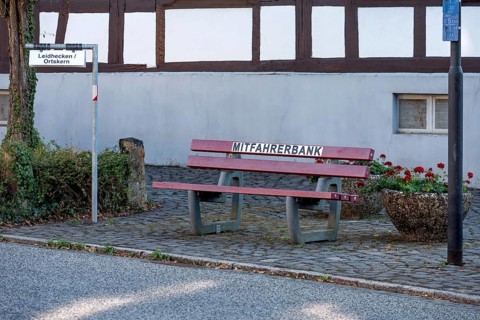 Carpool bench, carpool bench with direction sign for direction of travel, public bench for private