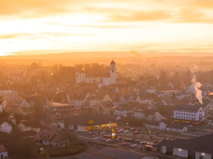 Panorama of a town at dusk, bathed in warm colours by the sunset, Meßkirch, Sigmaringen district,