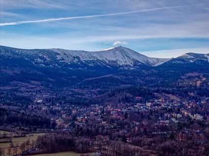 The town of Karpacz and the Giant Mountains with the Schneekoppe on a winter morning. Aerial photo.