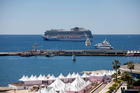Cannes, France - 23 May 2024: A cruise ship anchors in front of the beach on the Promenade de la